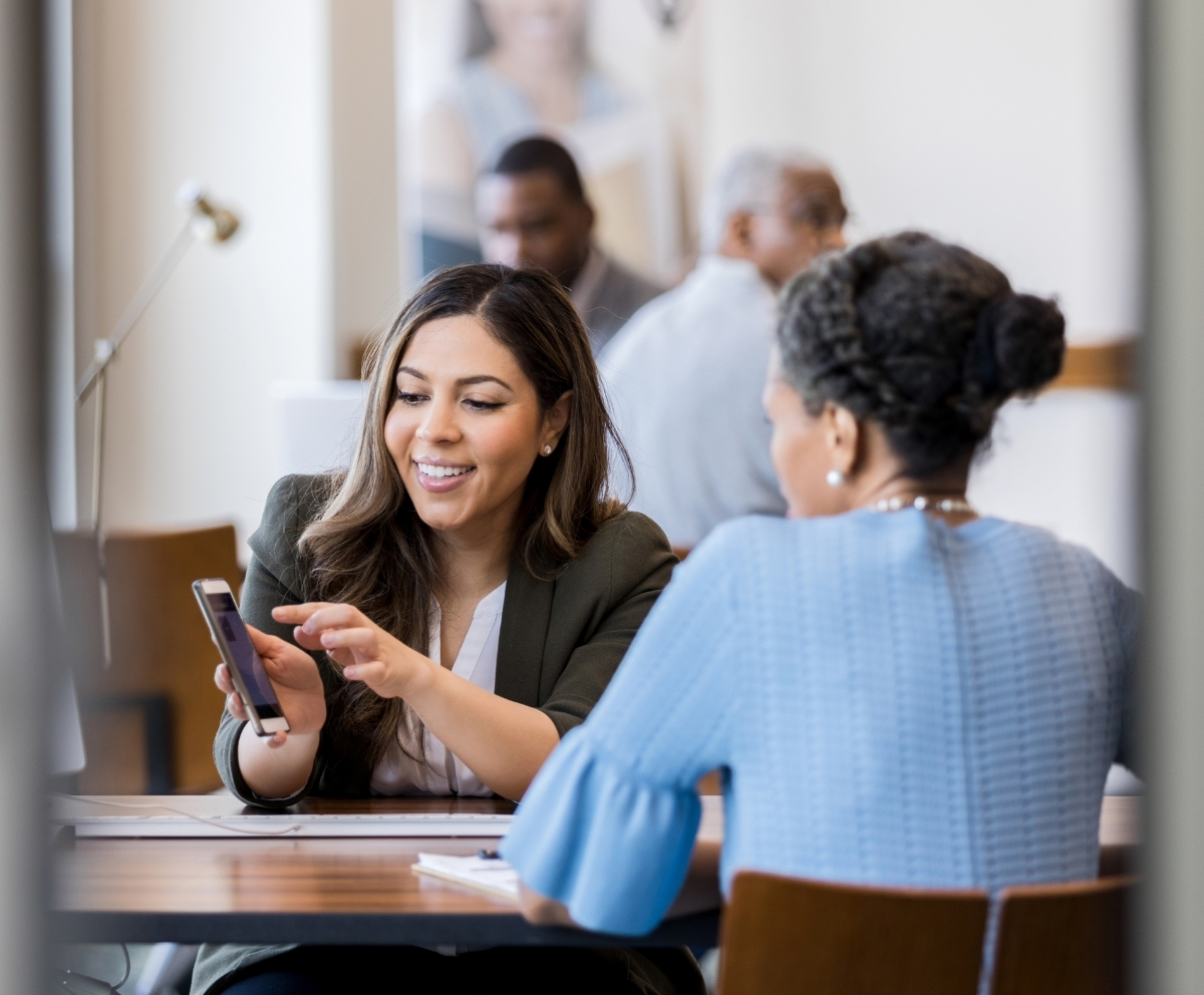 Credit union representative helping a member review auto loan options