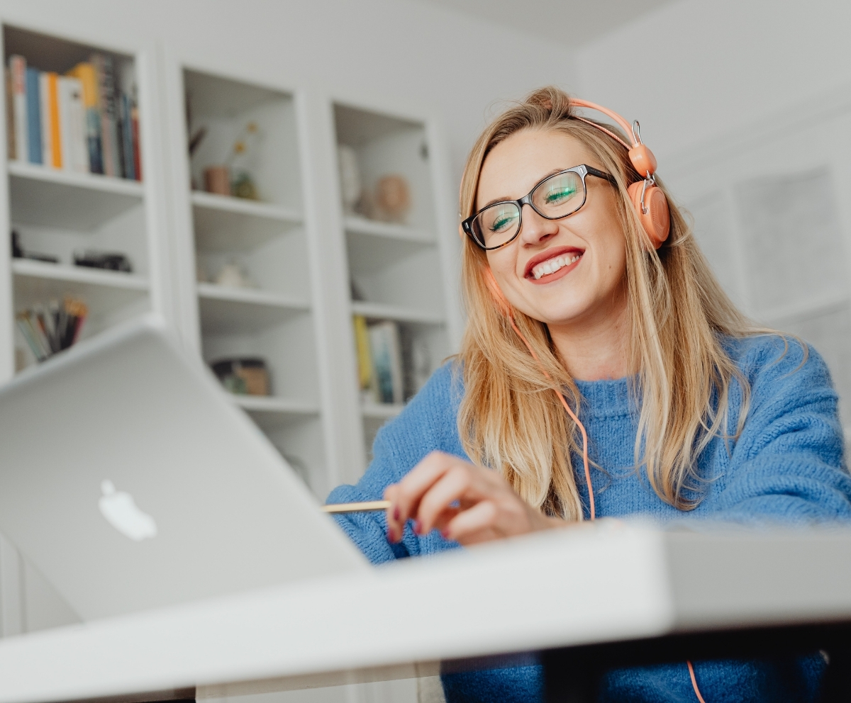 Woman using online banking on a laptop for everyday checking account management