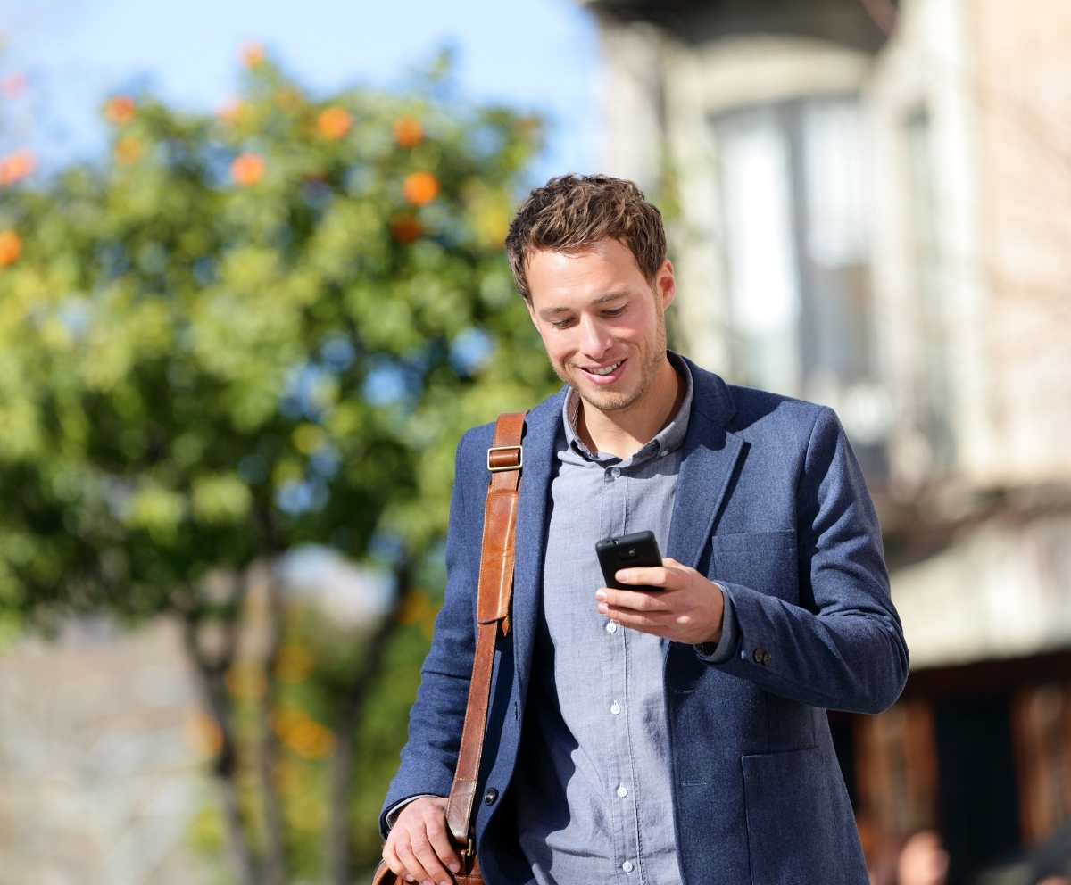 Man checking eChecking account activity from a smartphone while on the go