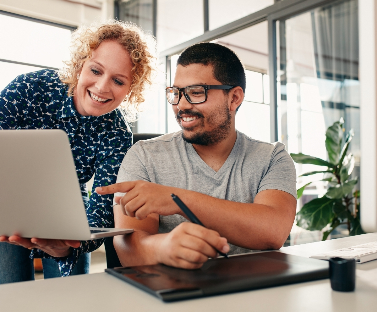Two people reviewing digital banking details for an eChecking account on a laptop