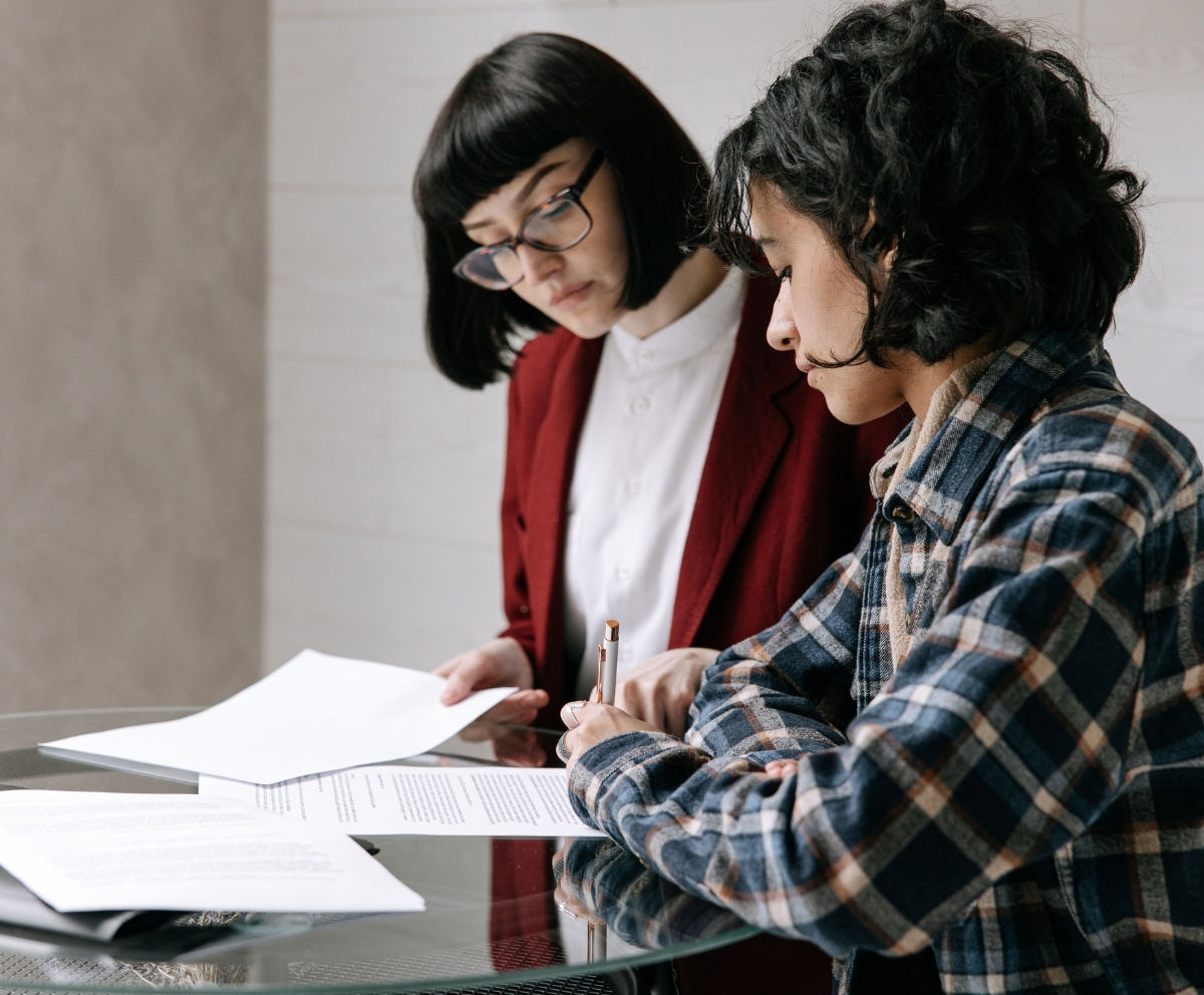 Member signing Home Equity Line of Credit documents with a lending professional