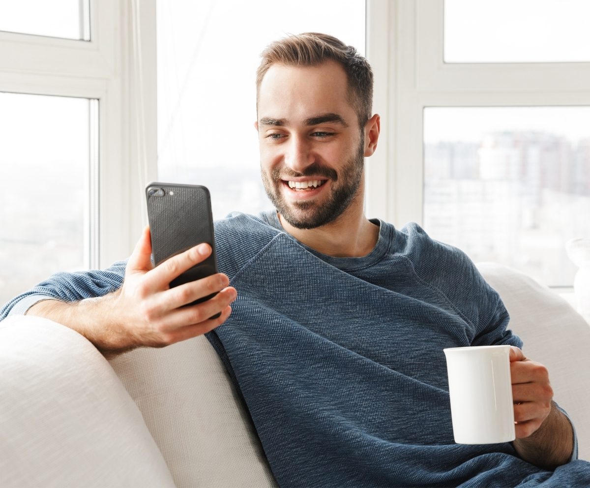 Traveler using mobile banking while away from home