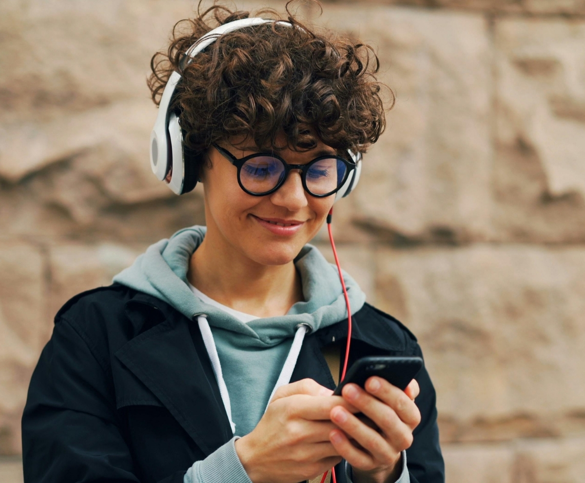 Person using a smartphone to manage accounts with Mobile Banking
