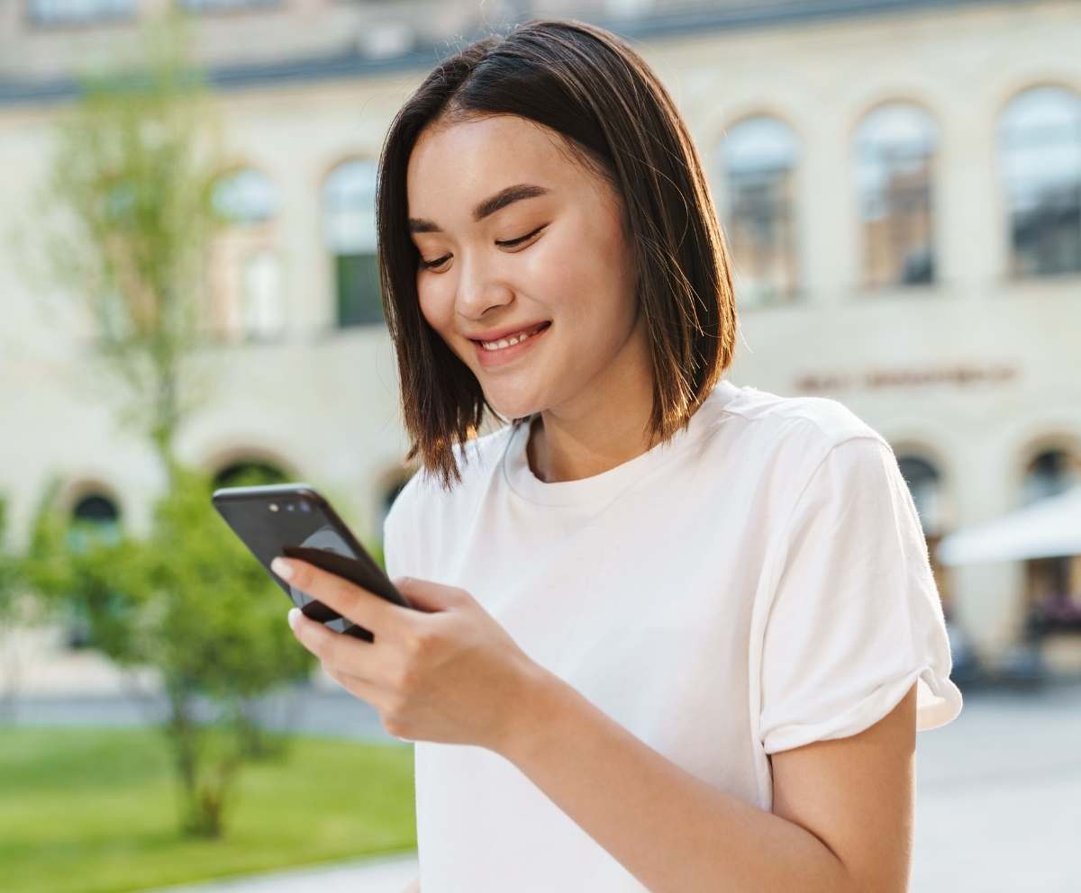 Woman using a smartphone for Mobile Wallet and contactless payment access