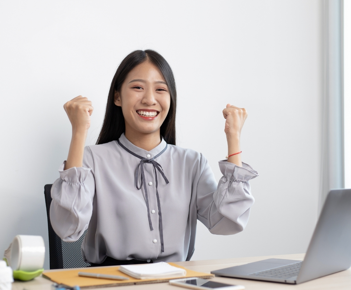New credit union member celebrating after opening an account online