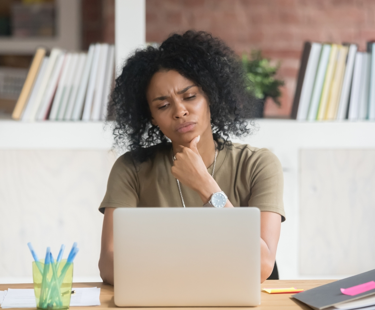 Woman checking her balances online to consider if a balance transfer is right for her.